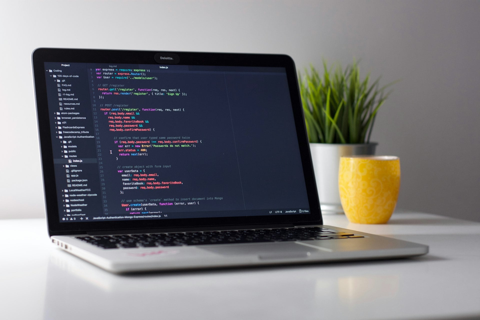 Modern software development workspace with multiple monitors